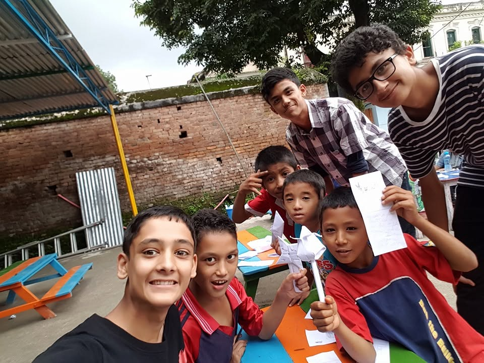 Akshat teaching geometry through origami with children in Nepal